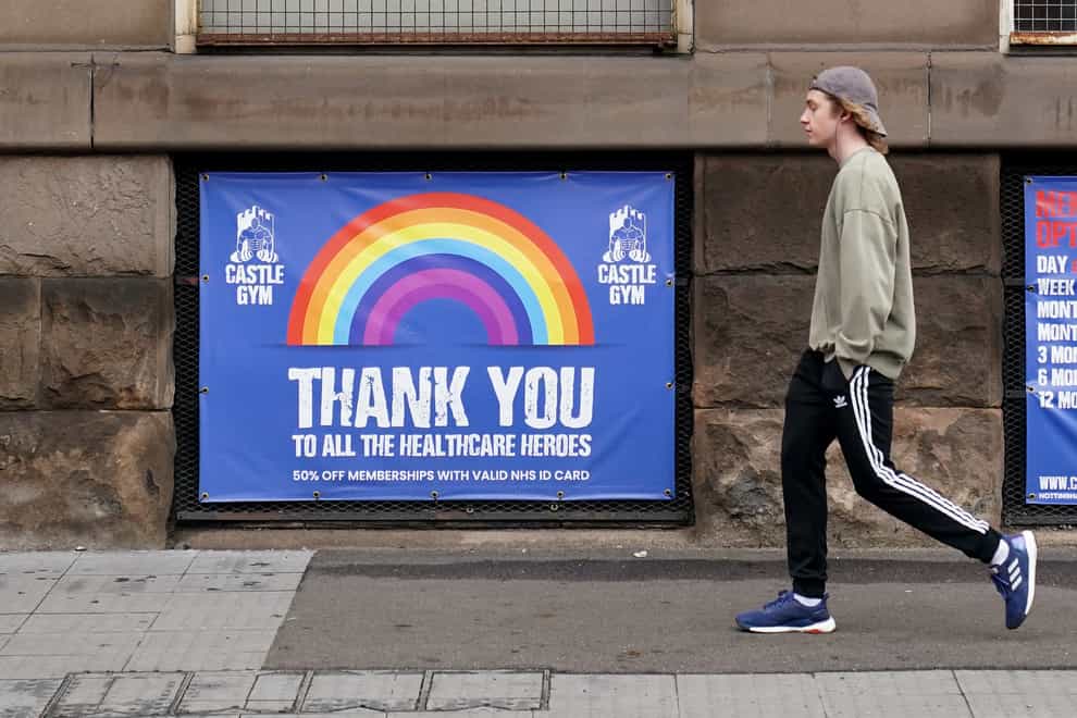 A pedestrian walks past a sign thanking the NHS in Nottingham city centre (Zac Goodwin/PA)