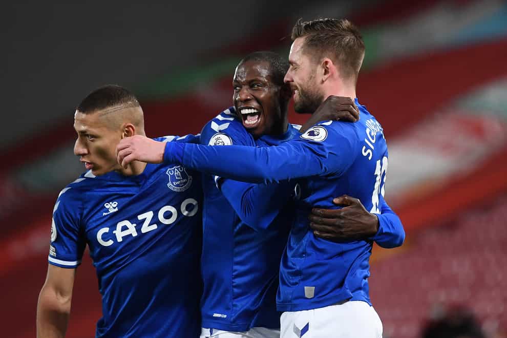 Gylfi Sigurdsson (right) celebrates with team mates Abdoulaye Doucoure and Richarlison after putting Everton 2-0 up at Anfield.