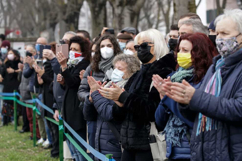 Residents of Codogno, northern Italy, attend the unveiling of a memorial for Covid deaths