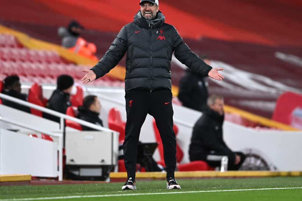 Liverpool manager Jurgen Klopp spreads his arms stood on the touchline