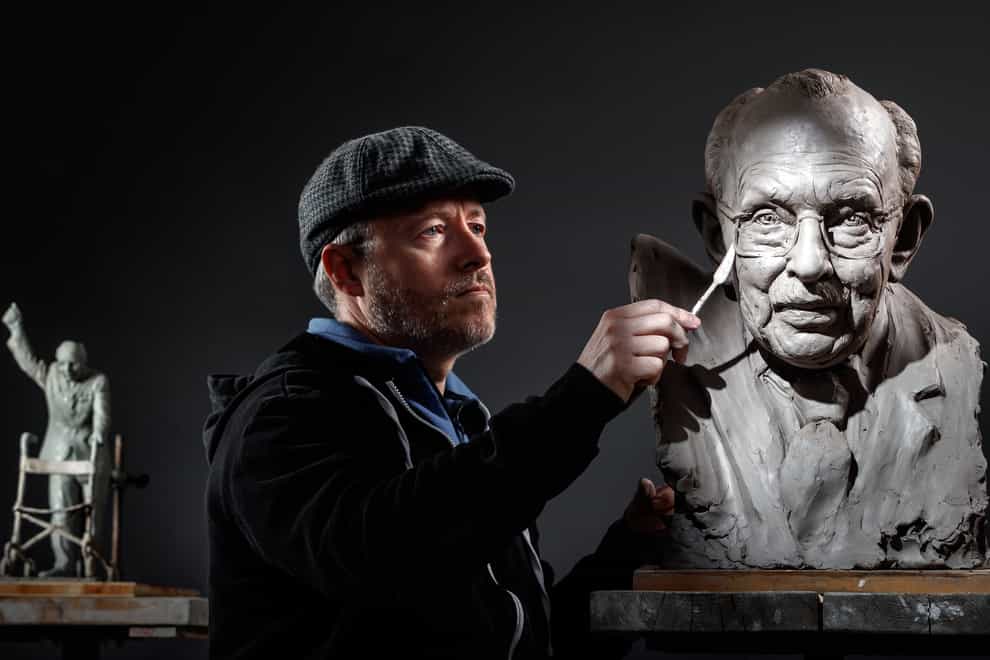 Sculptor Andrian Melka at his studio in York, working on a clay portrait of Captain Sir Tom Moore