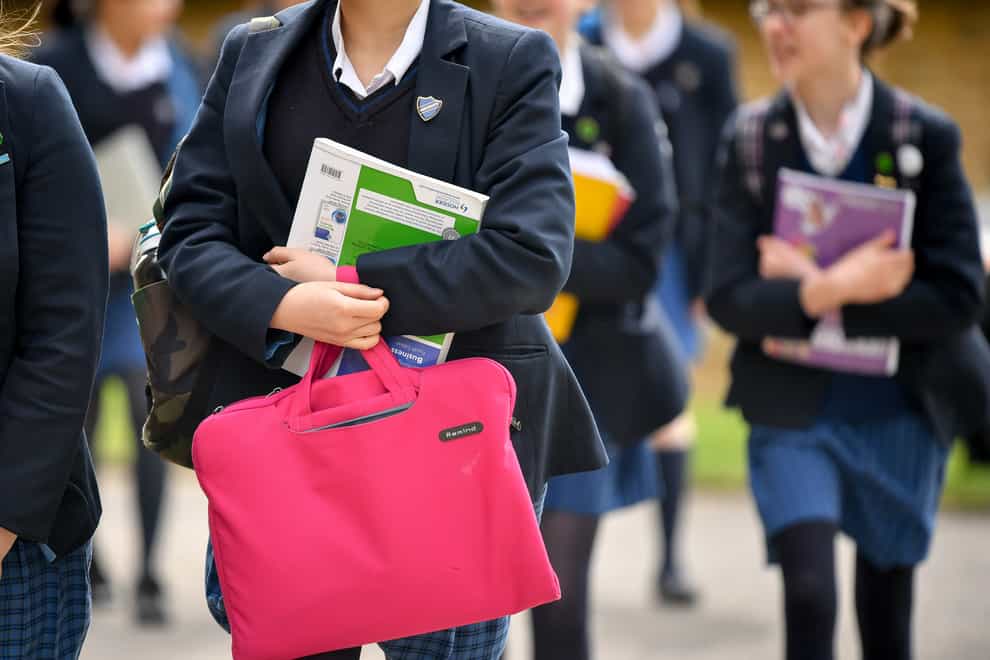 Students carry bags and books