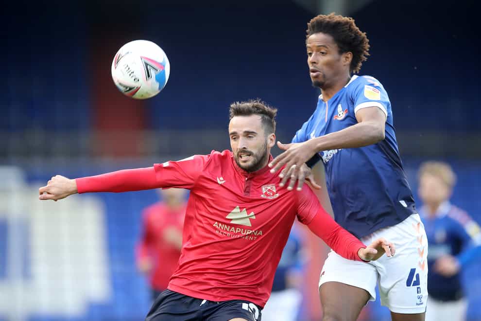 Oldham's Sido Jombati, right, is suspended for the visit of Barrow