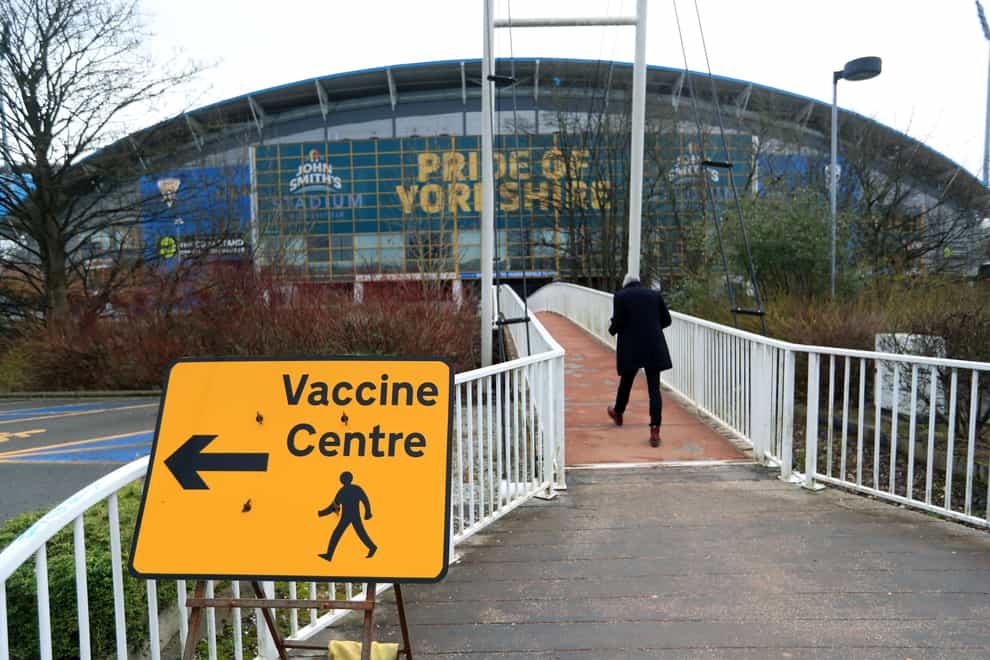 A sign to a vaccine centre near the John Smith’s Stadium, Huddersfield (Mike Egerton/PA)