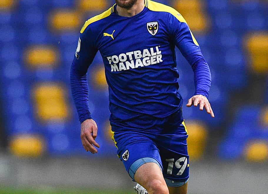 Shane McLoughlin could return to the fold for AFC Wimbledon against Gillingham after an injury