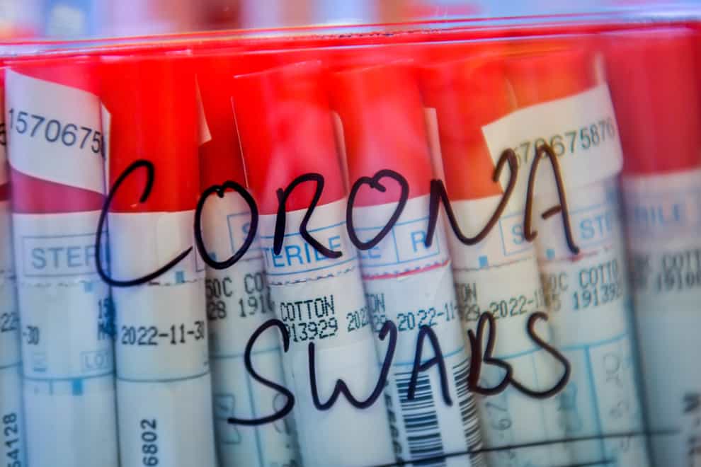 Coronavirus COVID-19 swabs from patients are kept in a plastic sealed tub as lab technicians carry out a diagnostic test for coronavirus in the microbiology laboratory inside the Specialist Virology Centre at the University Hospital of Wales in Cardiff. (Ben Birchall/PA)