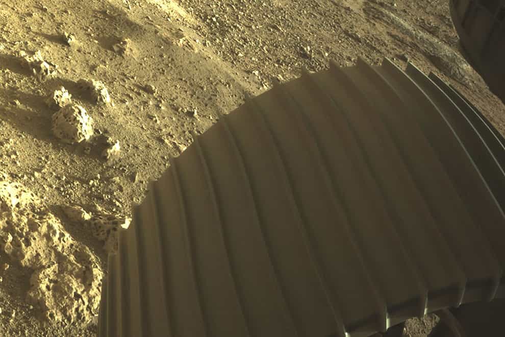 Image showing one of the six wheels aboard NASA’s Perseverance Mars rover after it touched down on Mars
