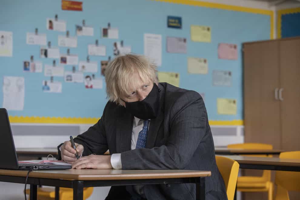 Prime Minister Boris Johnson in the library during a visit to Sedgehill Academy in Lewisham, south east London