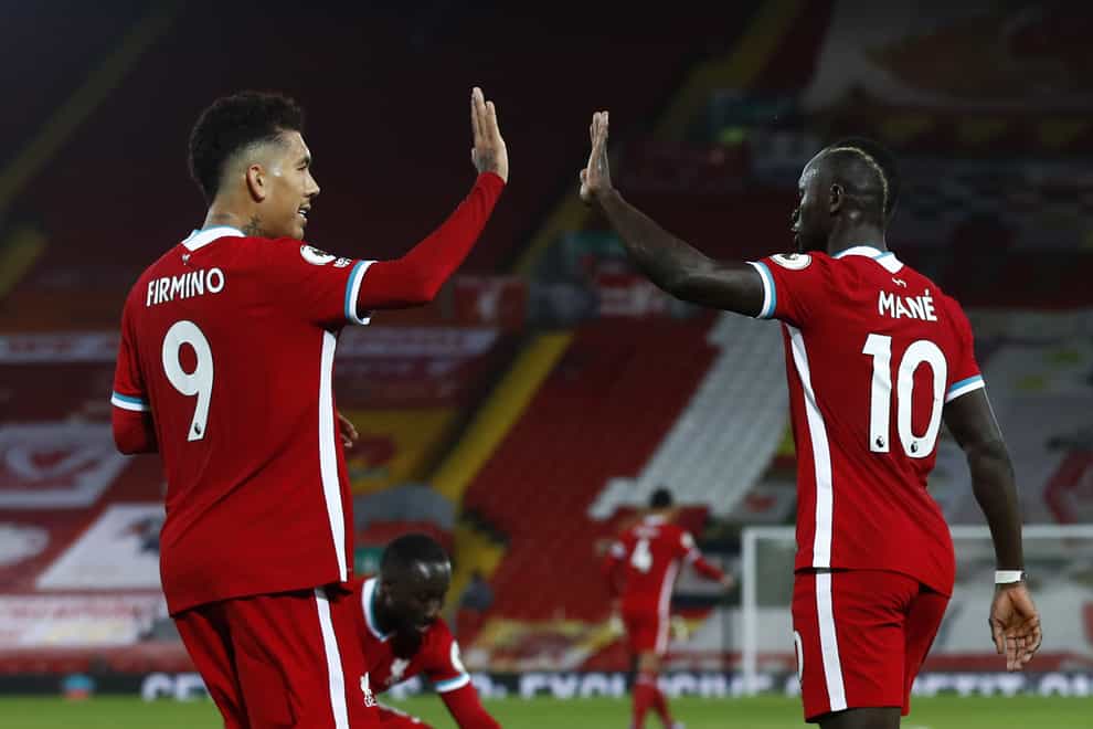 Liverpool forwards Roberto Firmino and Sadio Mane high-five each other