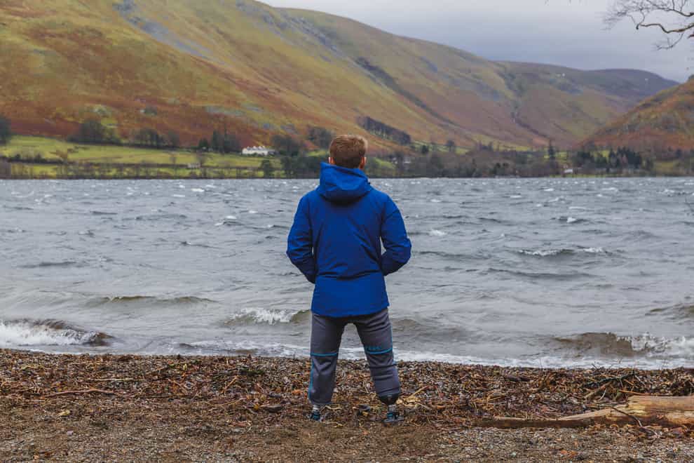 Billy Monger standing next to Lake Ullswater (Patch Dolan/Comic Relief/PA)