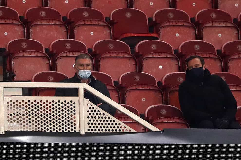 Nigel Pearson, left, watches his new side from the directors' box