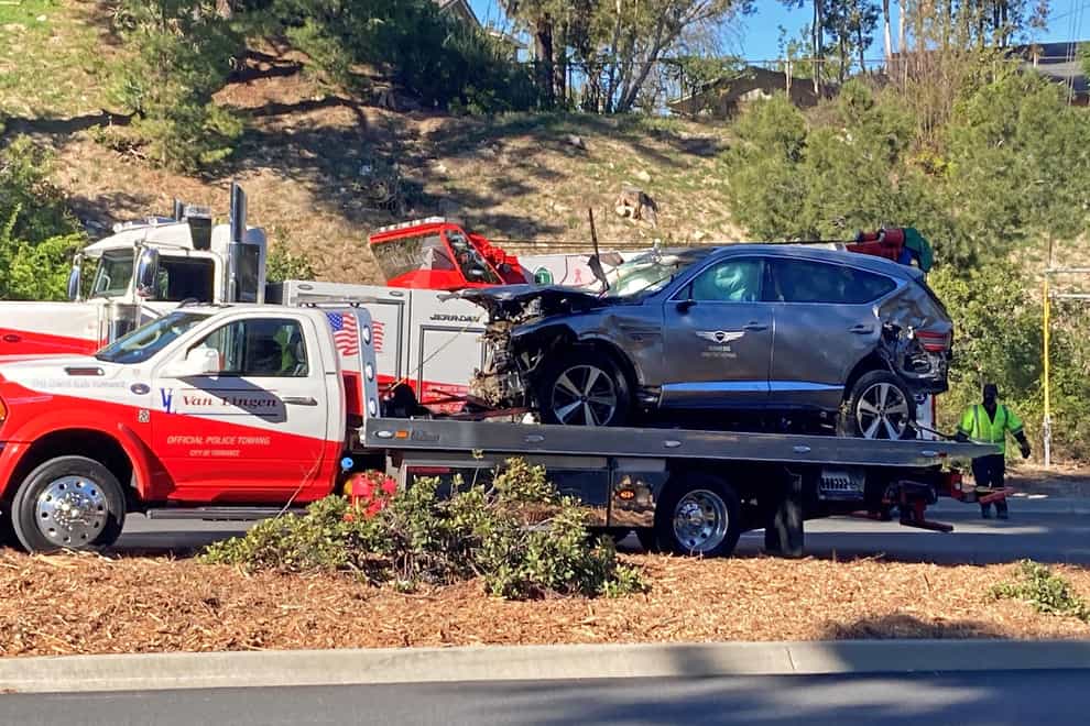 The vehicle driven by Tiger Woods on the back of a truck in Los Angeles after he suffered leg injuries when the vehicle rolled over