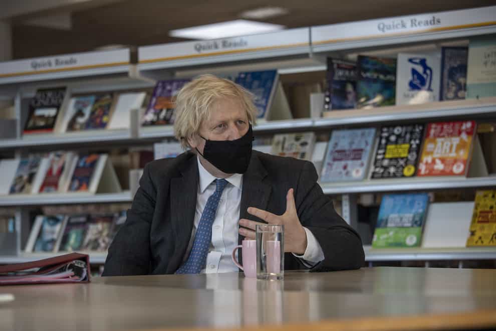 Prime Minister Boris Johnson meets with teachers in the library during a visit to Sedgehill School in Lewisham
