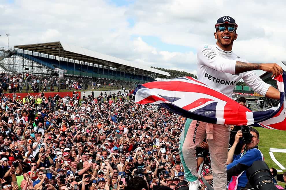 Lewis Hamilton celebrates winning the British Grand Prix