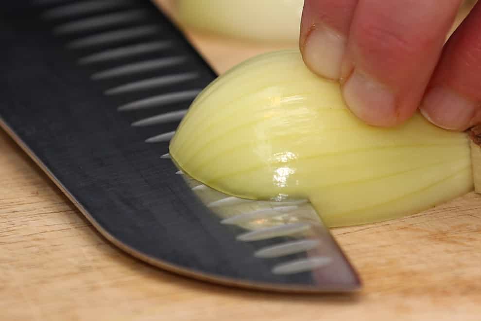 A general view of an onion being cut (Tim Goode/PA)