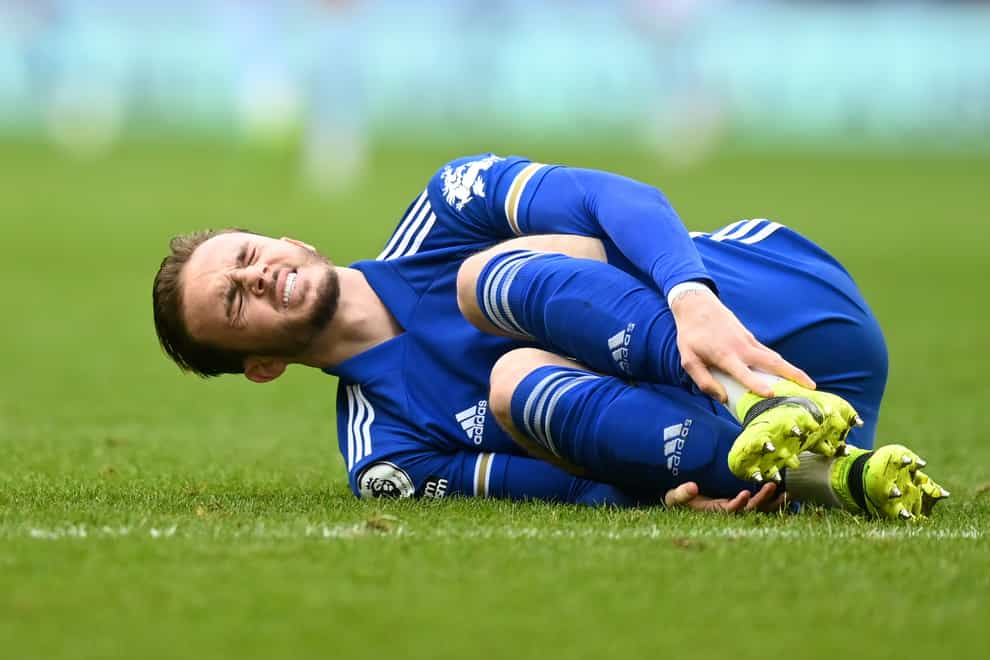 James Maddison lies on the pitch in pain