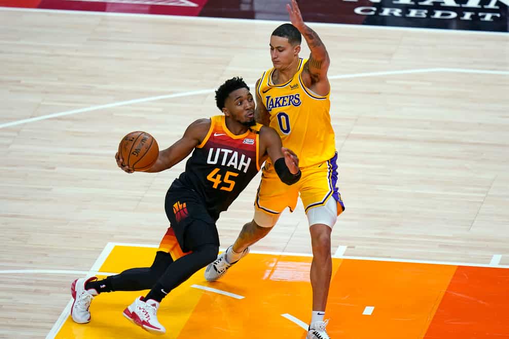 Utah Jazz guard Donovan Mitchell drives against Los Angeles Lakers forward Kyle Kuzma