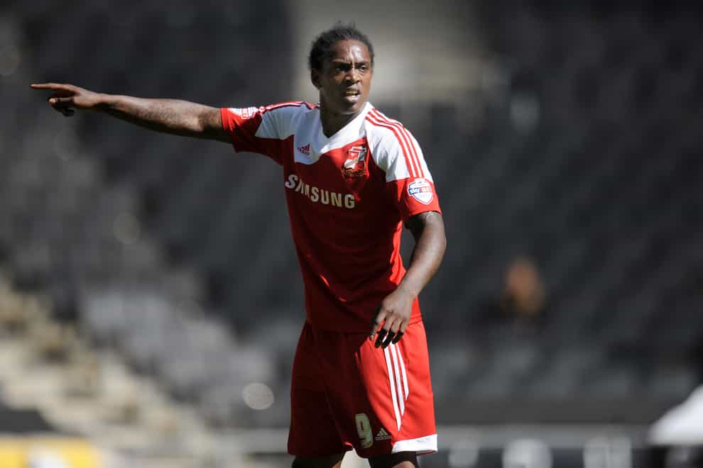 Striker Nile Ranger points on the pitch