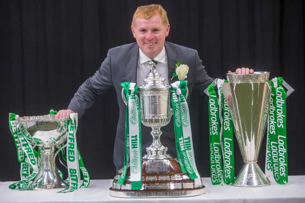 Neil Lennon poses with three trophies