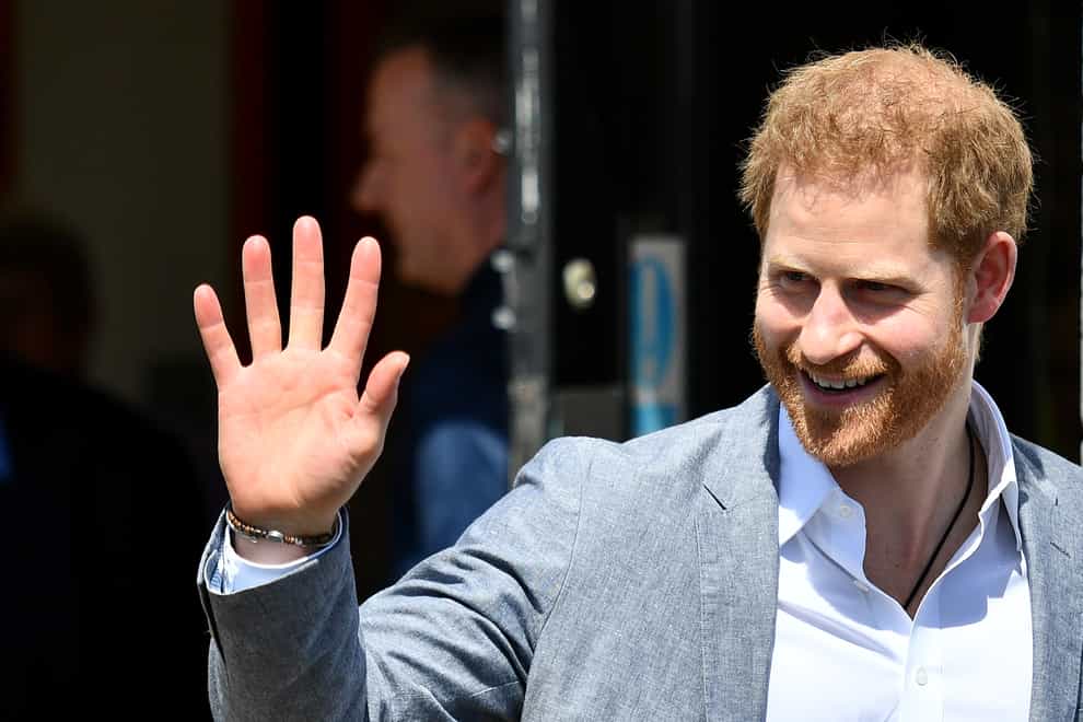 The Duke of Sussex smiling and waving