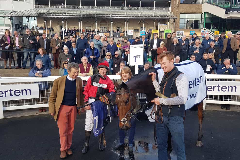 Winning trainer Caroline Bailey and jockey Jamie Moore pose with Crosspark after his win in the 2019 Eider Chase at Newcastle Racecourse