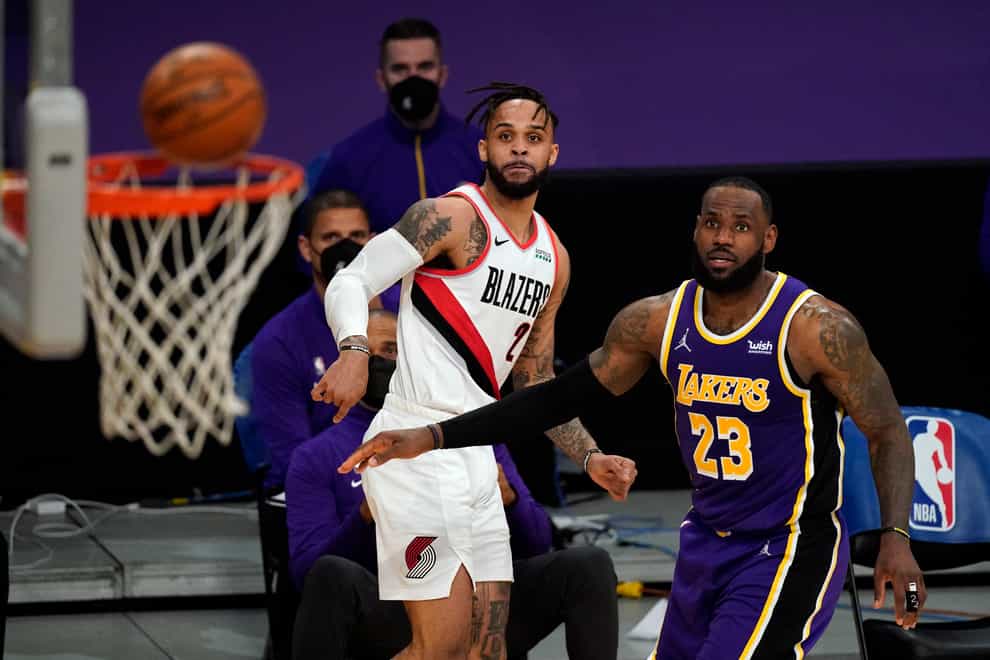 Portland Trail Blazers guard Gary Trent Jr. (2) and Los Angeles Lakers forward LeBron James (23) watch as a shot by Trent Jr misses the hoop