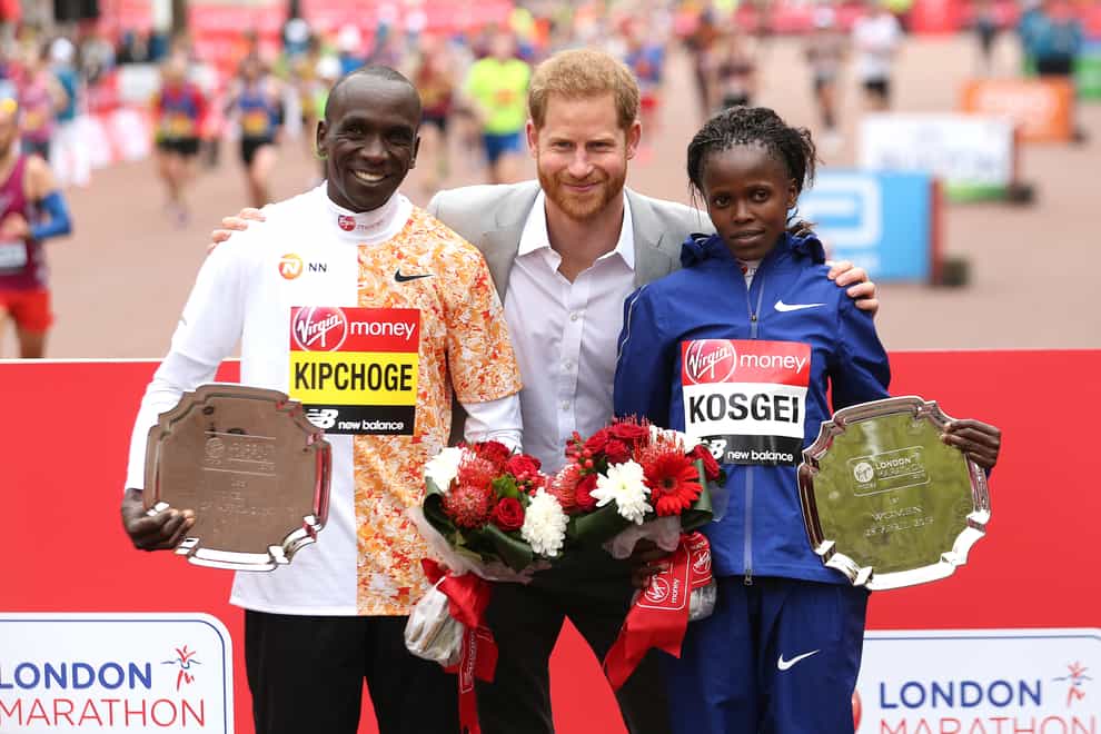 The Duke of Sussex poses with the winner of the men’s marathon Kenya’s Eliud Kipchoge and women’s marathon Kenya’s Brigid Kosgei during the 2019 Virgin Money London Marathon (Paul Harding/PA)