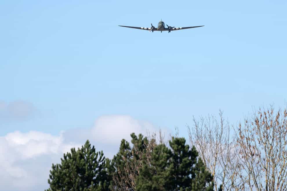 A Dakota performs a fly-past at the funeral