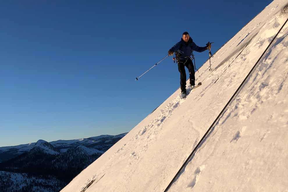 Zach Milligan is shown on his descent down Half Dome in Yosemite National Park, California