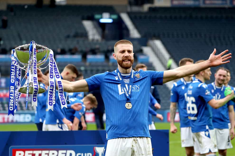 Shaun Rooney celebrates with the Betfred Cup trophy