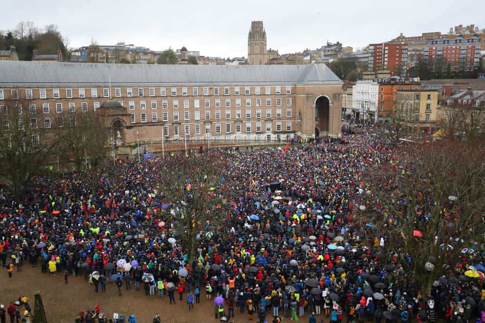 Thousands of people braved the rain to attend the protest (Aaron Chown/PA)