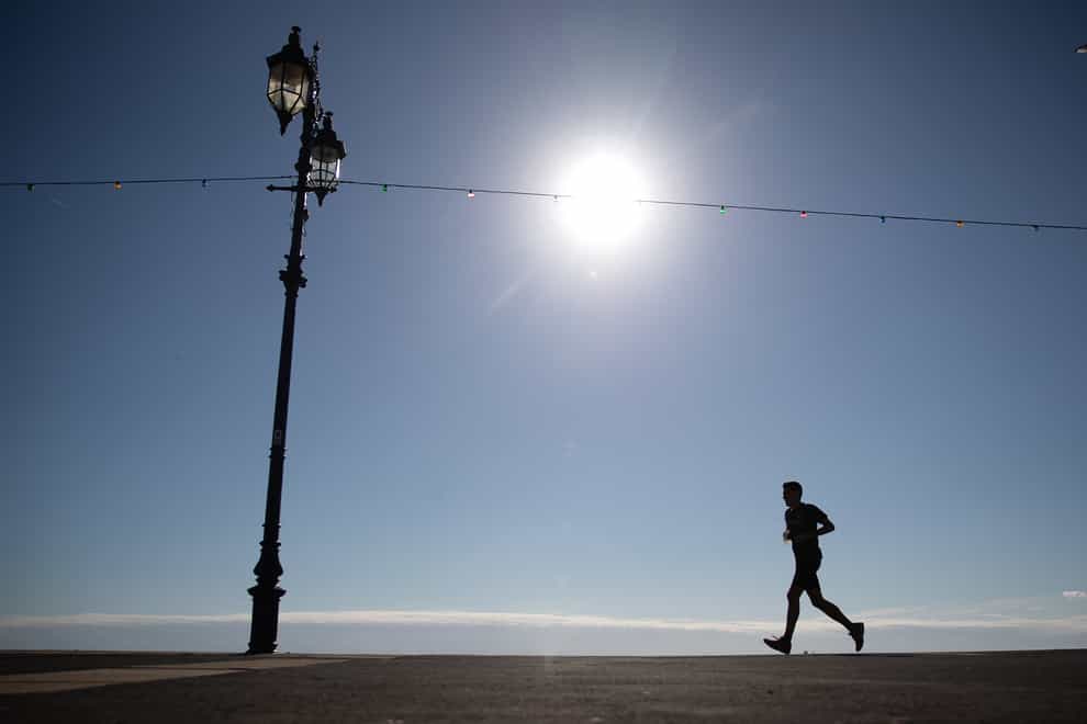 A jogger makes their way along the seafront on Southsea Beach in Hampshire