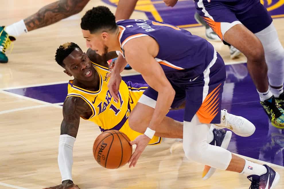 LA Lakers guard Dennis Schroder (left) and Phoenix Suns guard Devin Booker in action