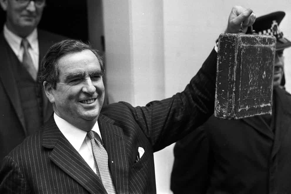 Denis Healey holds his Budget box outside 11 Downing Street in March 1974 (PA)
