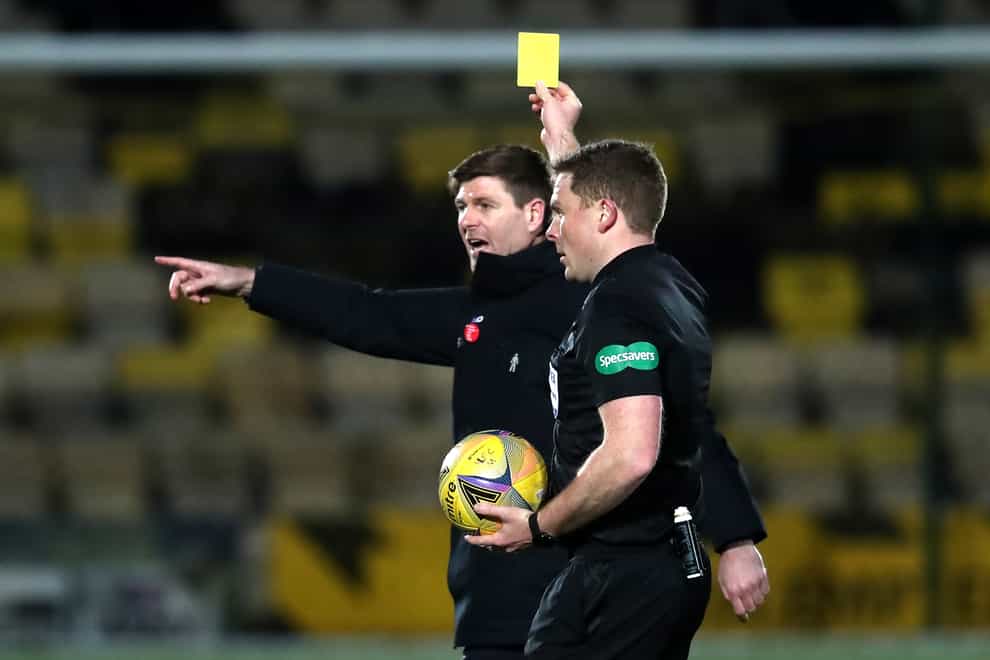 Steven Gerrard is shown a yellow card