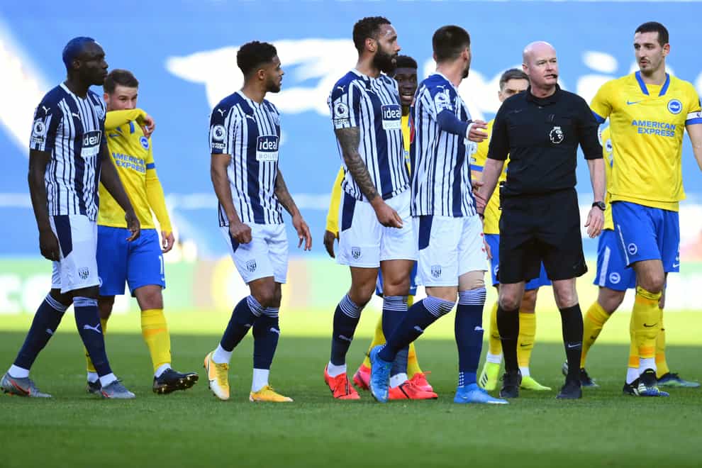 Referee Lee Mason and West Brom players