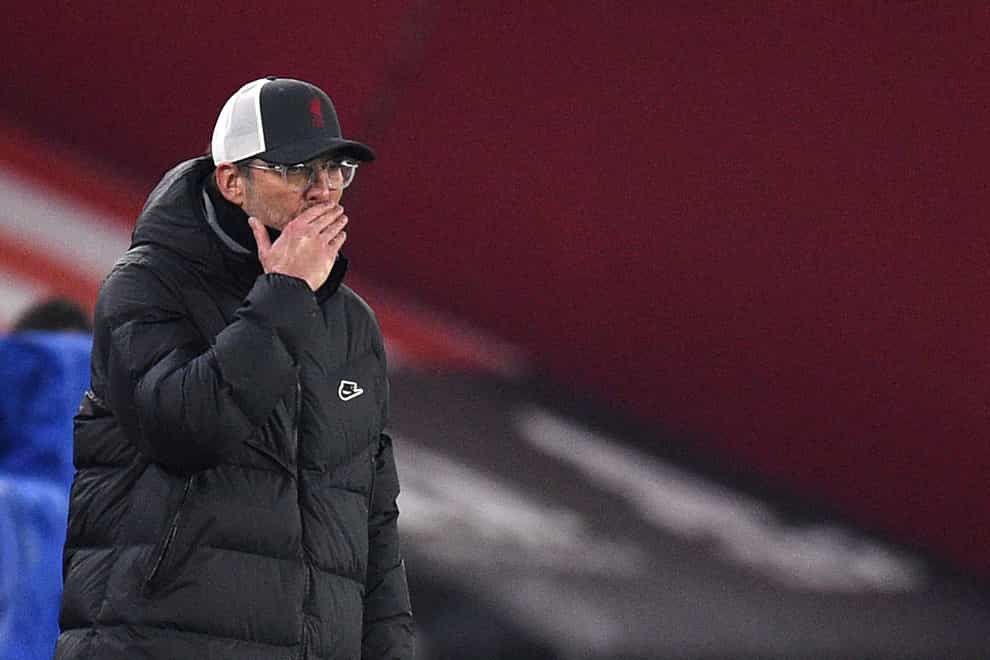 Liverpool manager Jurgen Klopp covers his mouth with his hand