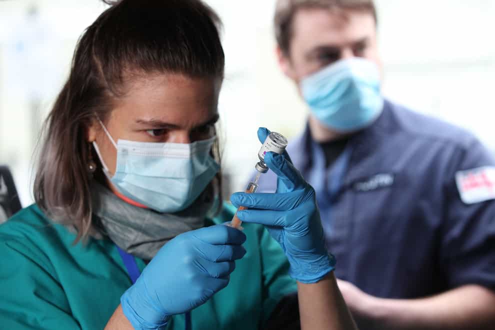 Medic prepares vaccine