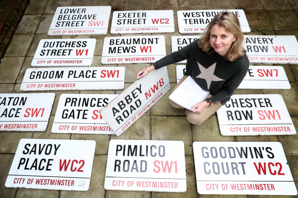 Auctioneer Catherine Southon with some of the London street signs