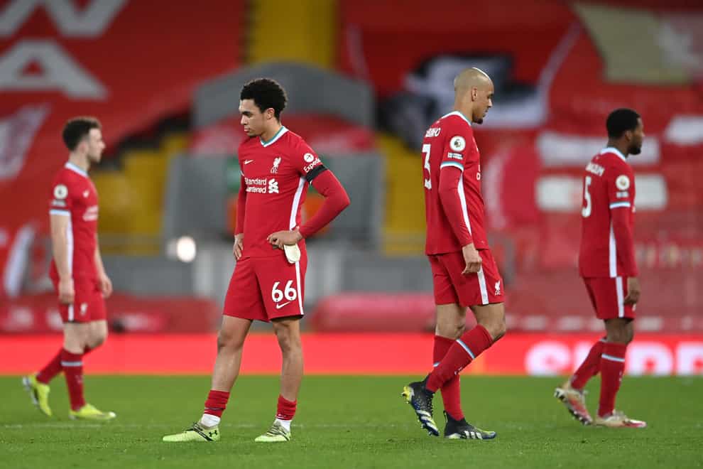 Liverpool’s dejected players following their 1-0 home defeat by Chelsea