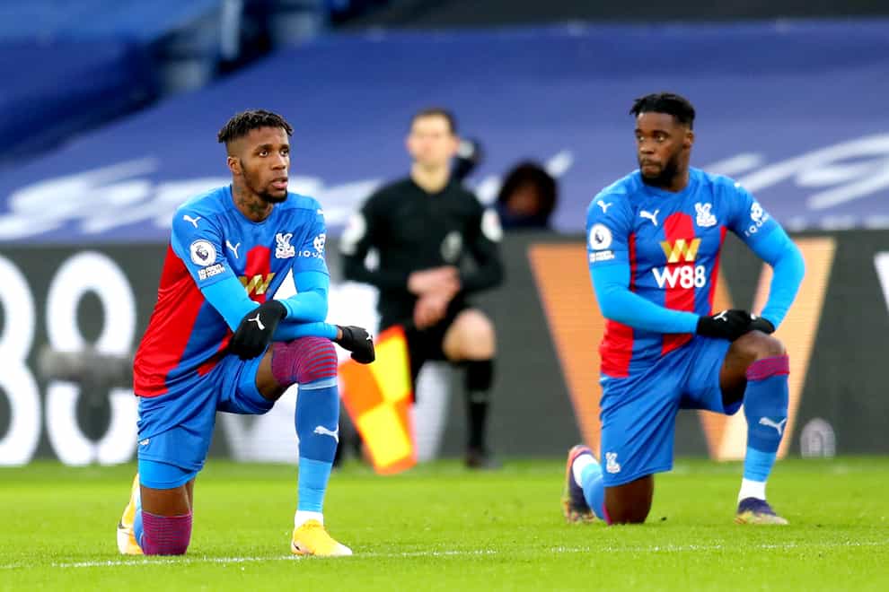 Wilfried Zaha takes the knee ahead of Crystal Palace's match with Sheffield United earlier this year