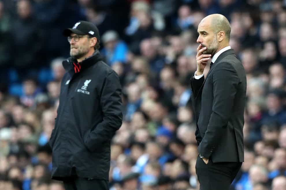 Pep Guardiola, right, said he would join Jurgen Klopp in preventing players from travelling if it would require quarantine