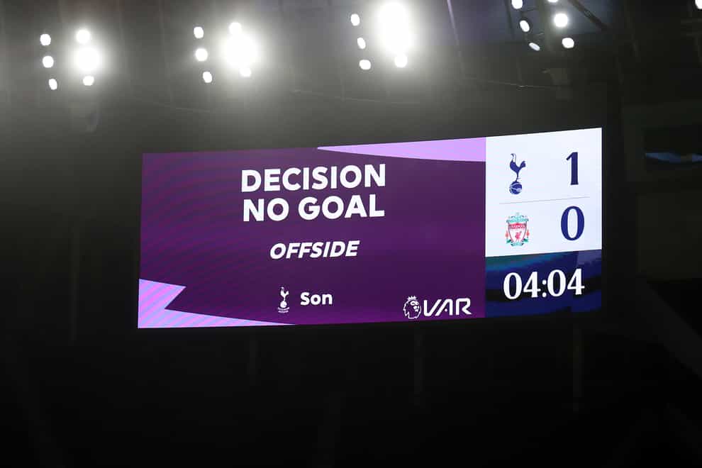 A scoreboard indicates a goal has been ruled out for offside