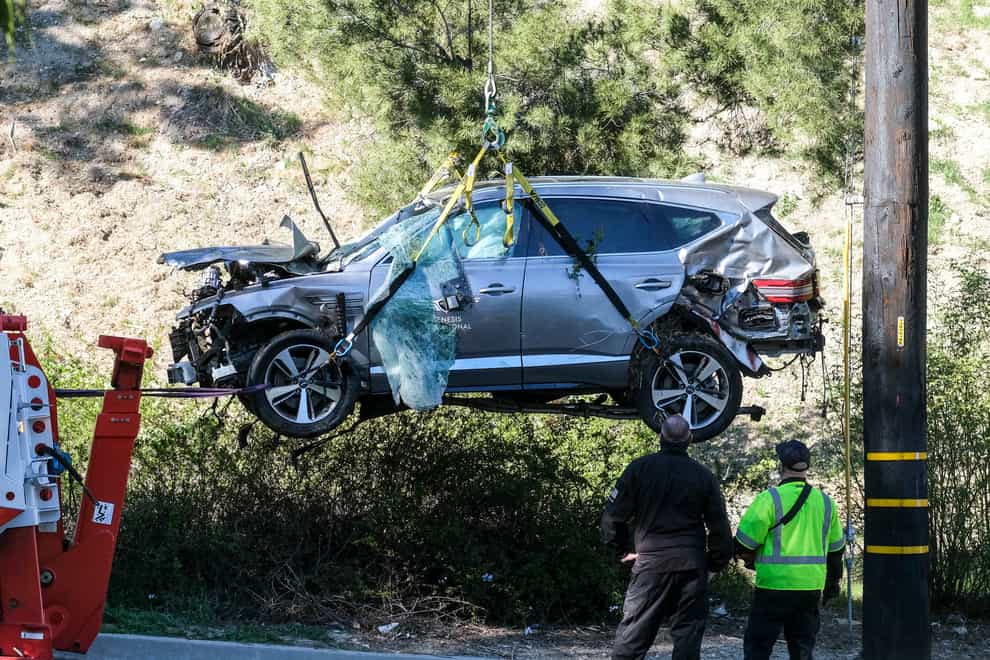 A crane is used to lift the vehicle Tiger Woods was driving in the crash