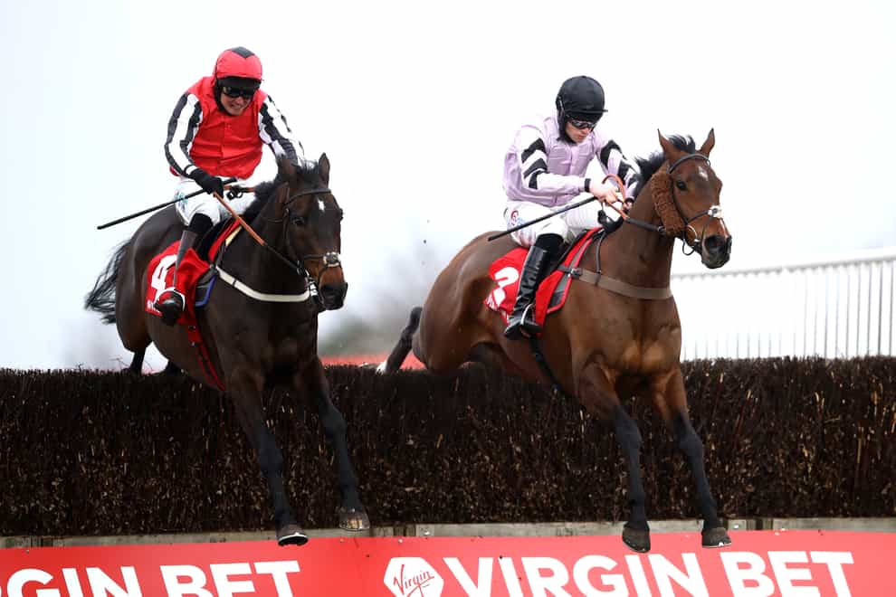 Getaway Trump and Lorcan Williams (right) on their way to winning the Virgin Bet Handicap Chase at Doncaster