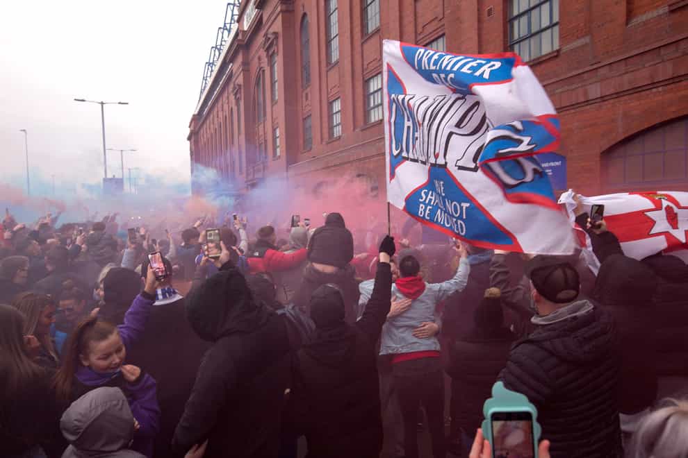 Rangers fans celebrated outside Ibrox as their team closed in on the Premiership title