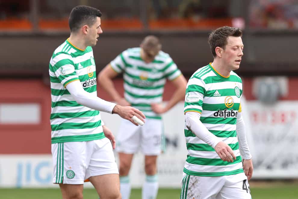Callum McGregor (right) appears dejected at the final whistle as Celtic's goalless draw against Dundee United confirmed Rangers as champions (Jeff Holmes/PA Images).