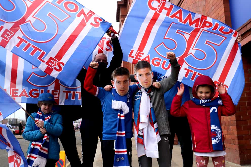Fans celebrate outside Ibrox after Rangers win the Scottish Premiership title
