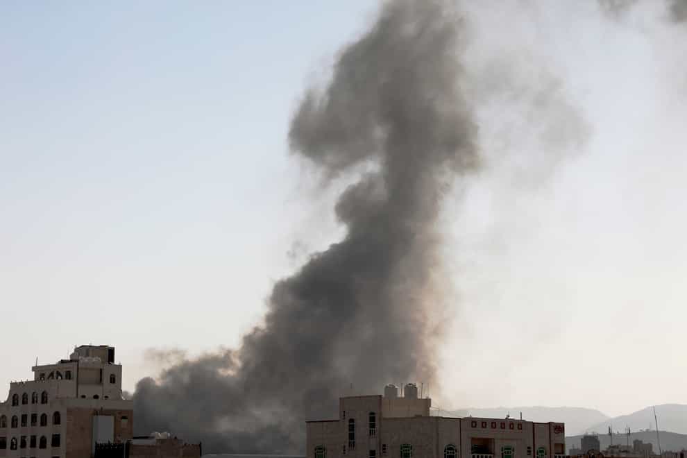 Smoke rises after Saudi-led air strikes on an army base in Sanaa, Yemen