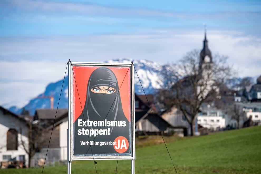 A poster supporting the ban on face coverings